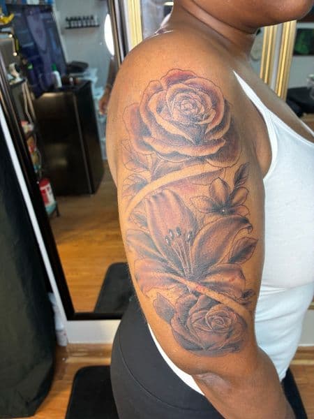 Floral + Black & Grey roses tattoo on Upper Arm by Bizzarreink on TattMe