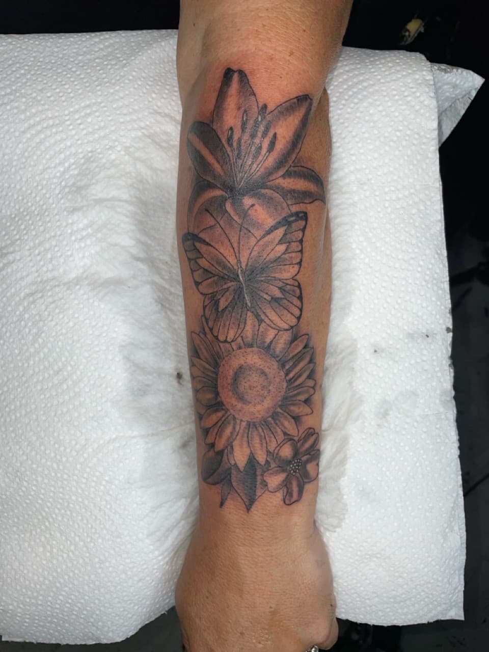 Black & Grey + Floral lily tattoo on Forearm by Bizzarreink on TattMe
