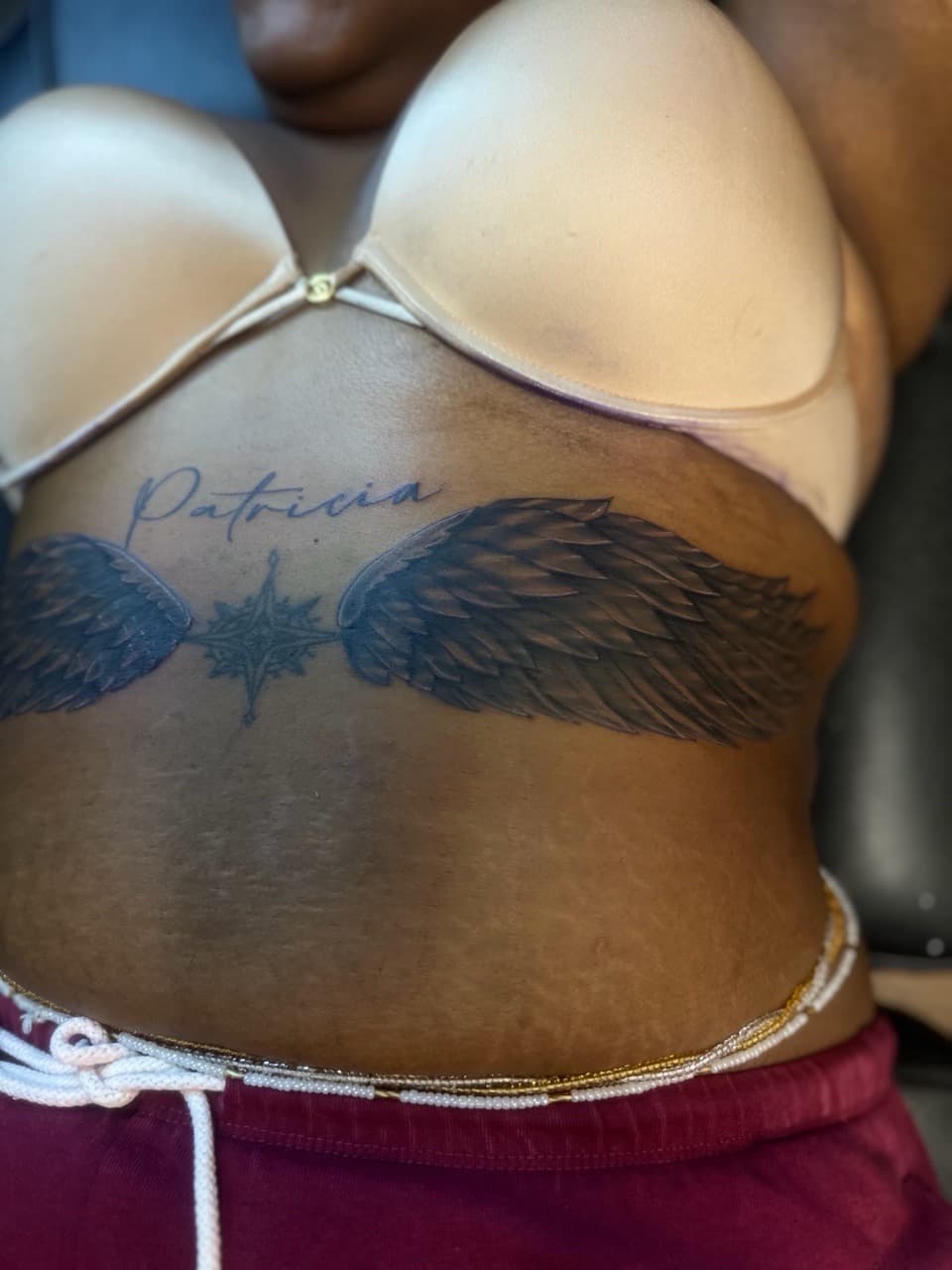 Black & Grey + Lettering wings tattoo on Stomach by Pooh_Ink on TattMe