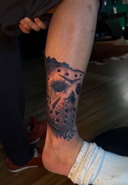 Black & Grey + Realism jason voorhees tattoo on Calf by Incredible_Ink on TattMe
