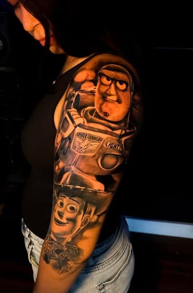 Black & Grey + Illustrative Realism buzz lightyear tattoo on Half Sleeve by Incredible_Ink on TattMe