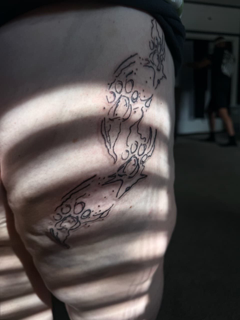 Fine Line + Black-work paw prints tattoo on Thigh by Sayas_Mind_Tattoos on TattMe