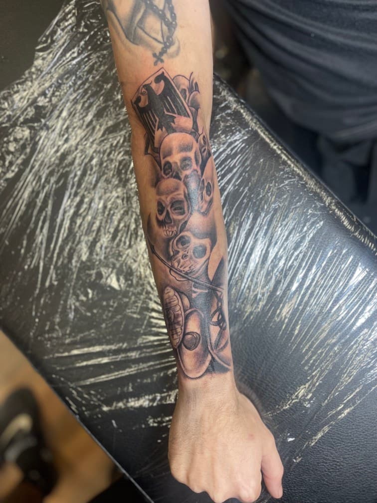 Black & Grey + Illustrative skulls tattoo on Forearm by 19ktattoos on TattMe