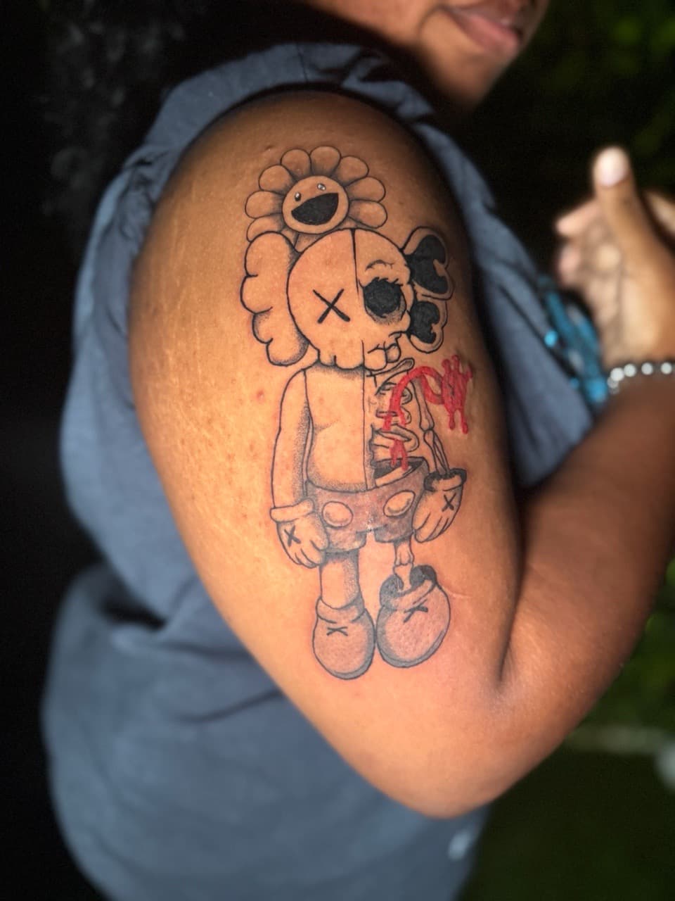 Illustrative + Pop Culture kaws tattoo on Upper Arm by Edwaun_Randall on TattMe