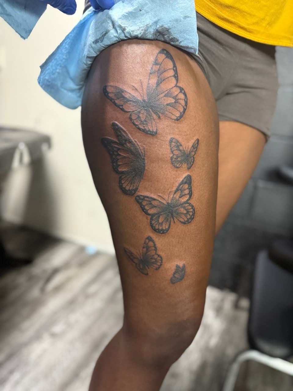 Black & Grey + Fine Line butterflies tattoo on Thigh by Edwaun_Randall on TattMe