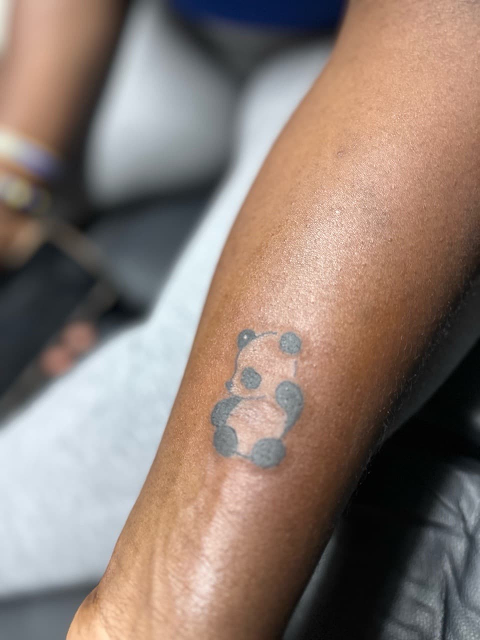 Minimalist + Black & Grey panda tattoo on Forearm by Edwaun_Randall on TattMe