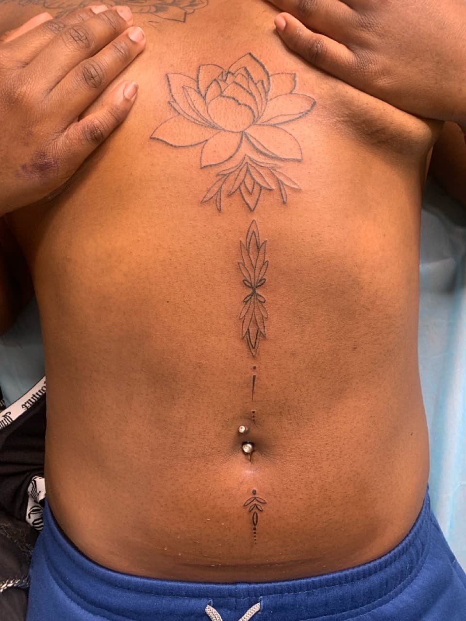 Fine Line + Floral lotus tattoo on Sternum by Mafia_Ink on TattMe