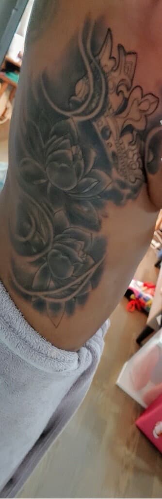 Black & Grey + Floral flowers tattoo on Ribs by Mafia_Ink on TattMe