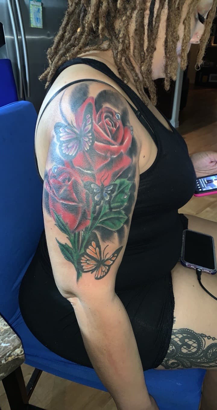 Color + Floral roses tattoo on Upper Arm by Mafia_Ink on TattMe
