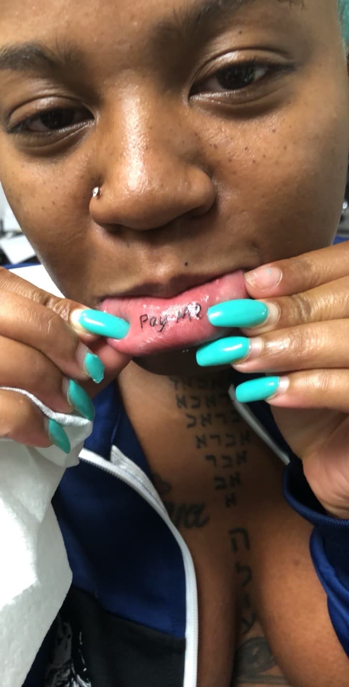 Lettering + Black-work inner lip tattoo on Face by Mafia_Ink on TattMe