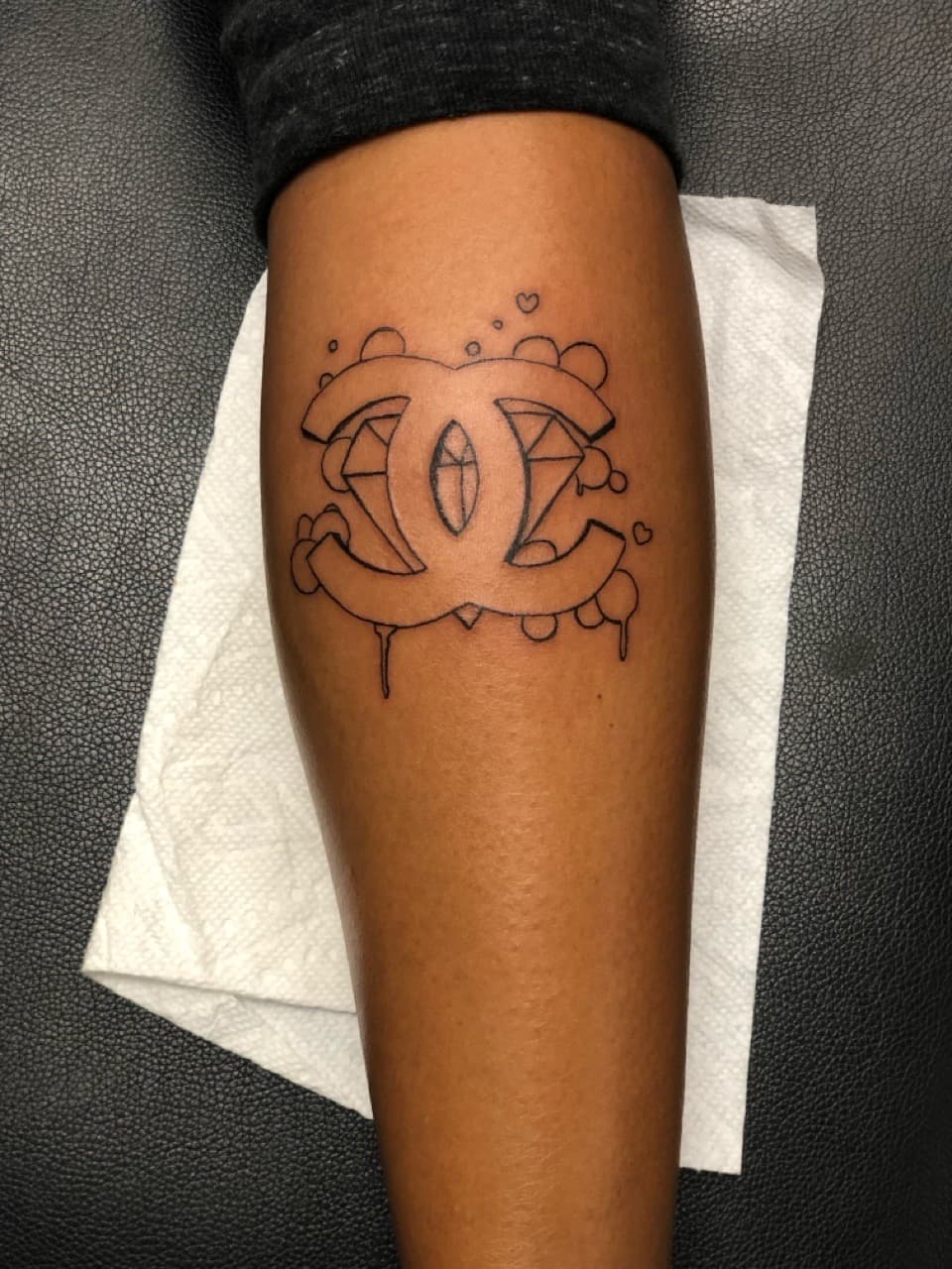 Line-work + Pop Culture chanel tattoo on Calf by Mafia_Ink on TattMe