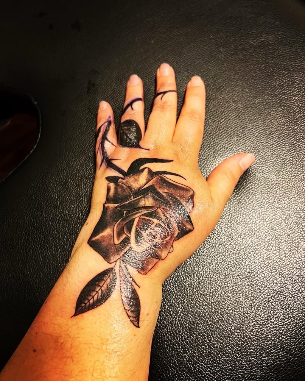 Black & Grey + Floral rose tattoo on Hand by Mafia_Ink on TattMe