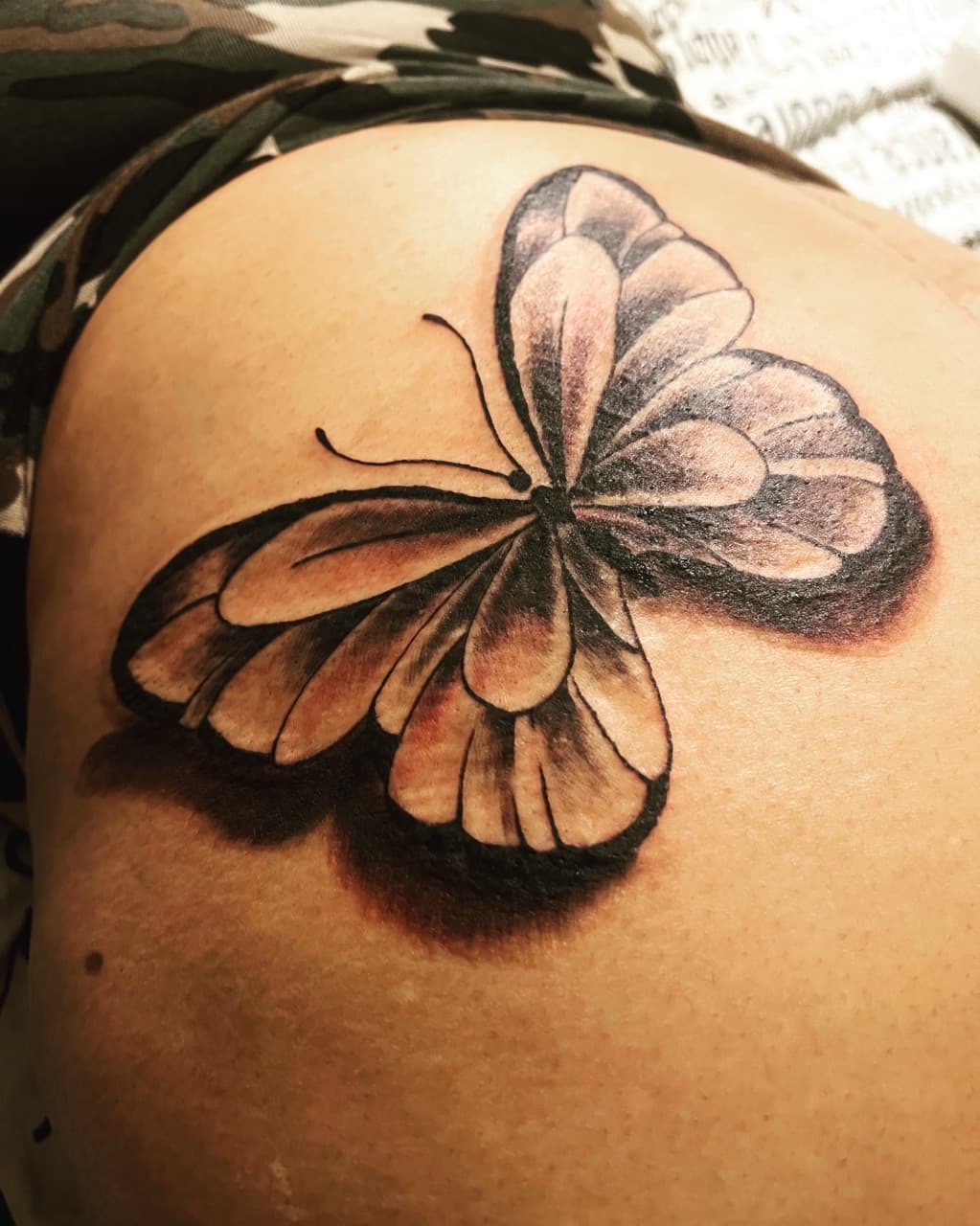 Black & Grey + Illustrative butterfly tattoo on Upper Back by Mafia_Ink on TattMe