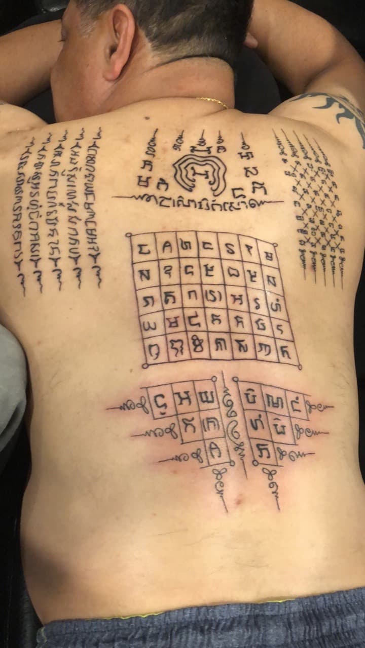 Black-work + Line-work symbols tattoo on Upper Back by Mafia_Ink on TattMe