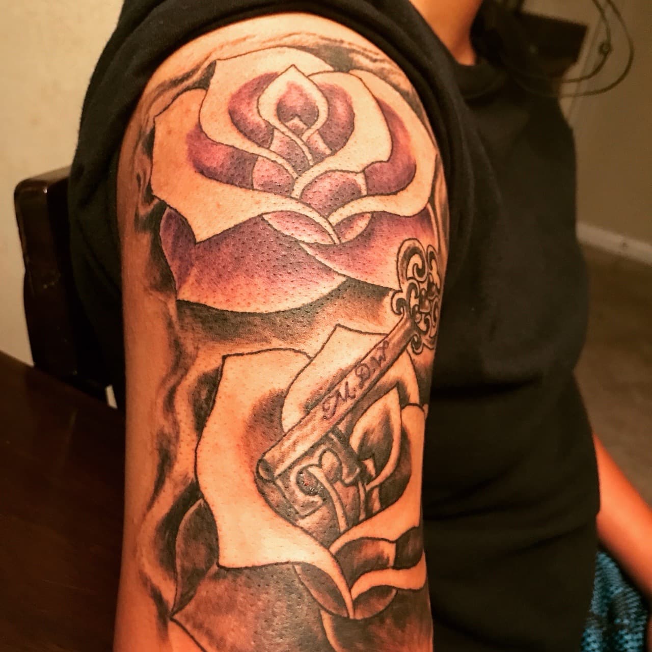Black & Grey + Floral roses tattoo on Upper Arm by Mafia_Ink on TattMe