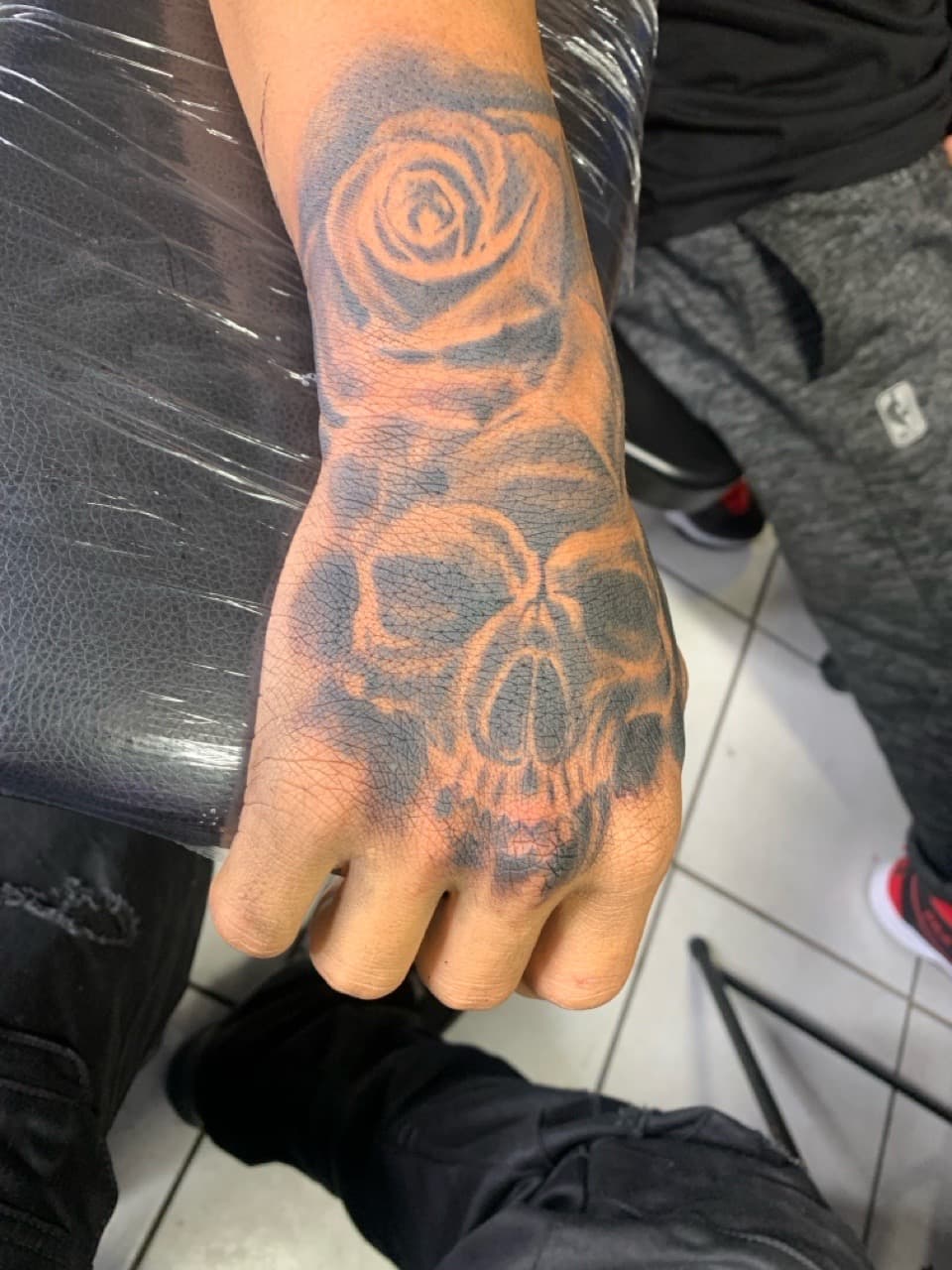 Black & Grey + Illustrative skull tattoo on Hand by Mafia_Ink on TattMe