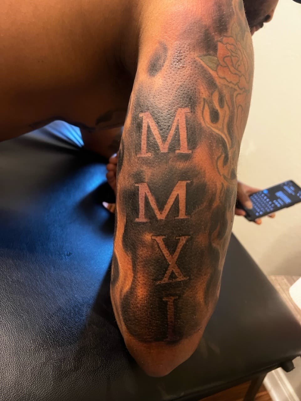 Lettering + Black & Grey roman numerals tattoo on Upper Arm by Mafia_Ink on TattMe