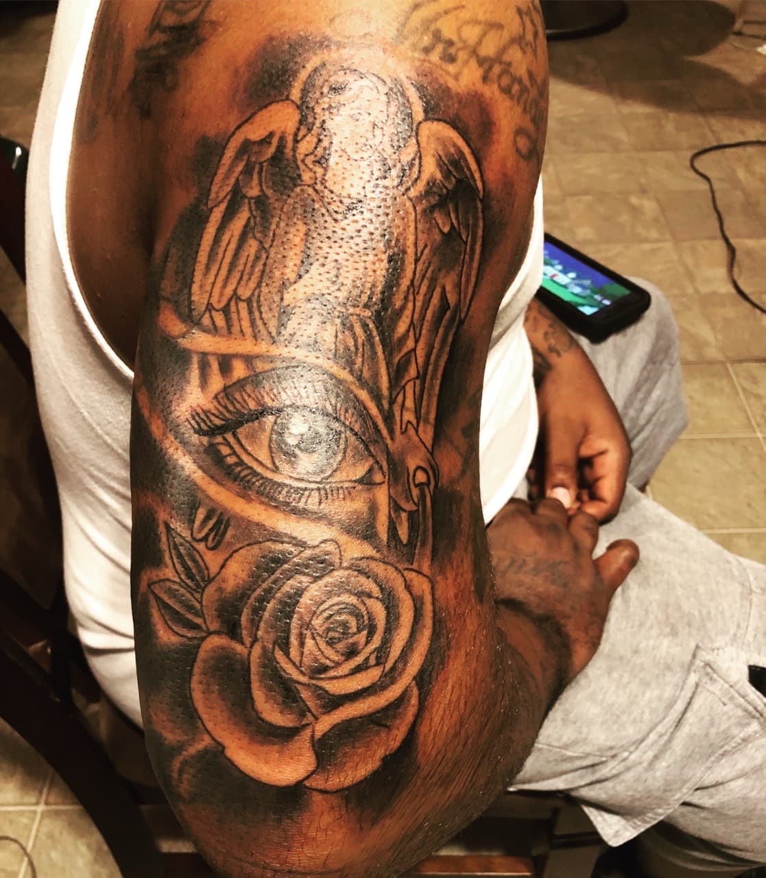 Black & Grey + Illustrative angel tattoo on Upper Arm by Mafia_Ink on TattMe