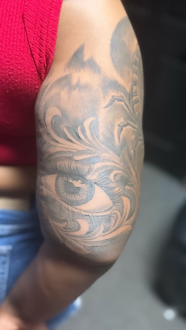 Black & Grey + Illustrative eye tattoo on Upper Arm by Mafia_Ink on TattMe