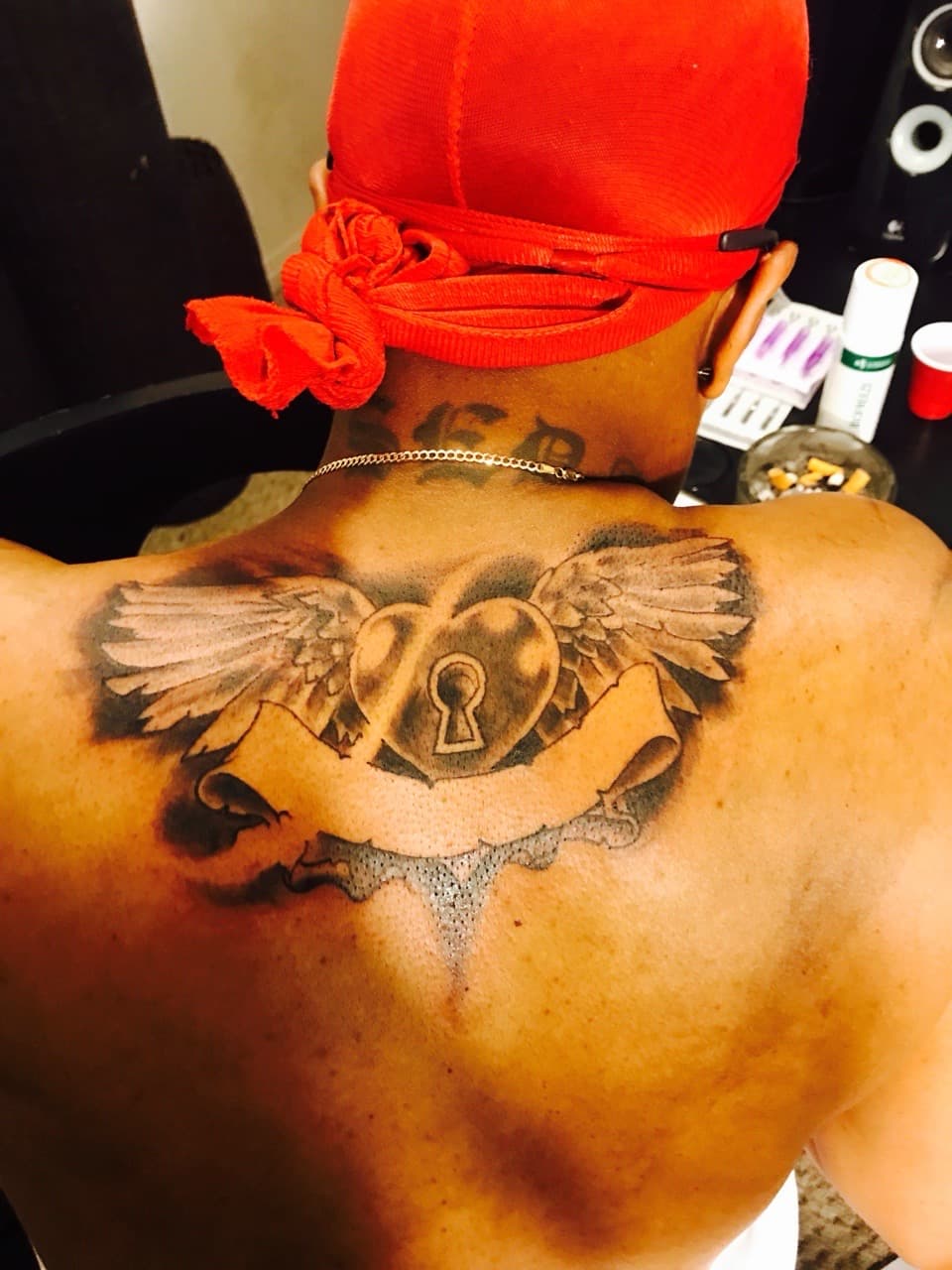 Black & Grey + Illustrative heart tattoo on Upper Back by Mafia_Ink on TattMe