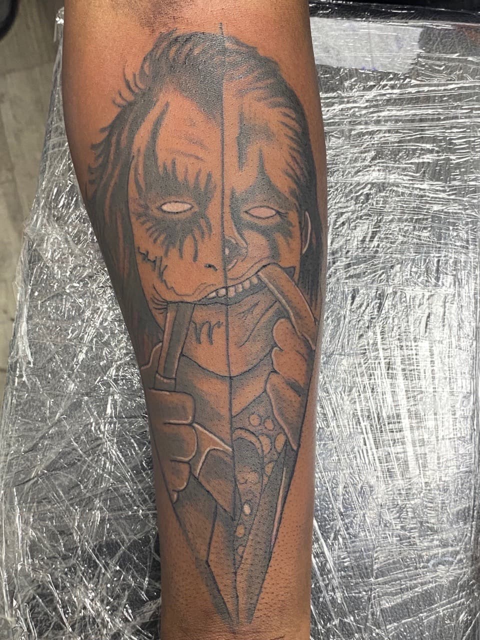Black & Grey + Illustrative joker tattoo on Forearm by InkGuru_Sway on TattMe