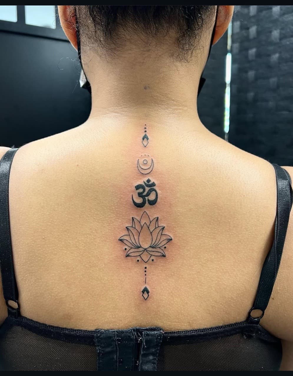 Fine Line + Black-work om symbol tattoo on Spine by abutattoo1 on TattMe