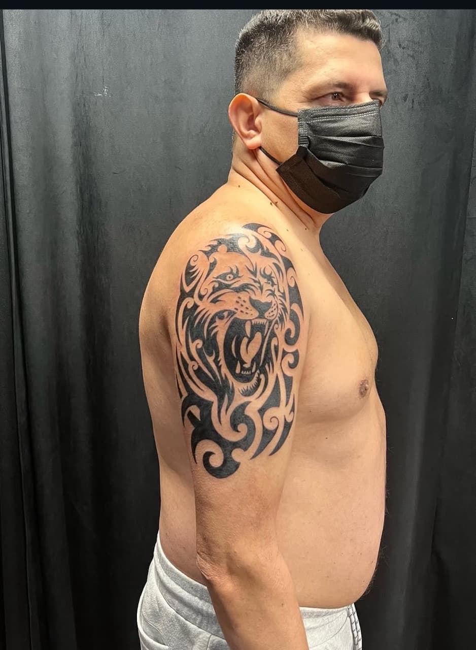 Tribal + Black-work lion tattoo on Upper Arm by abutattoo1 on TattMe