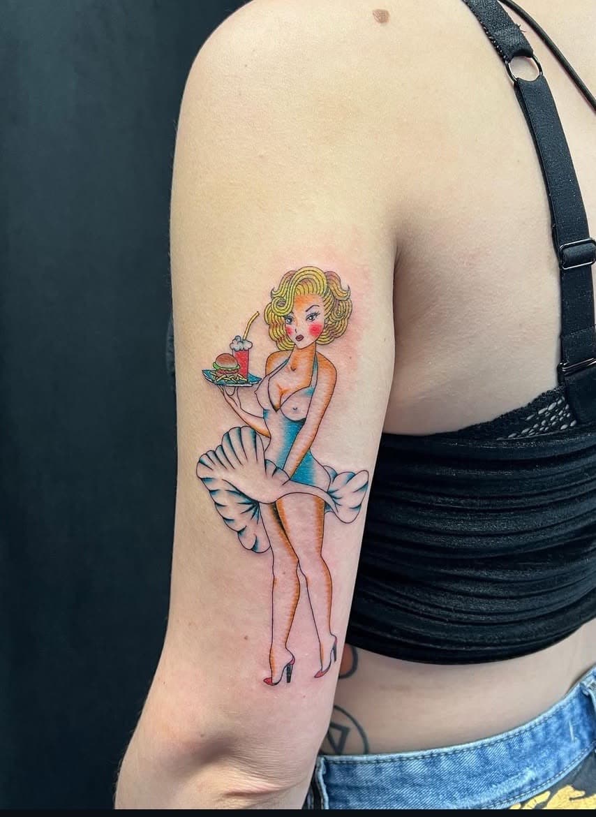Traditional + American Traditional pin-up girl tattoo on Upper Arm by abutattoo1 on TattMe