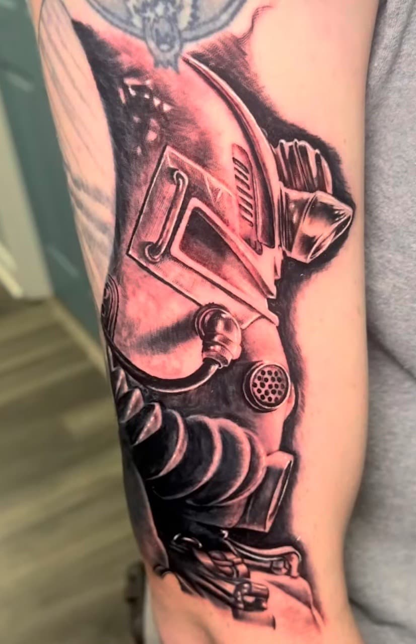 Black & Grey + Illustrative gas mask tattoo on Upper Arm by XRayVizionz on TattMe