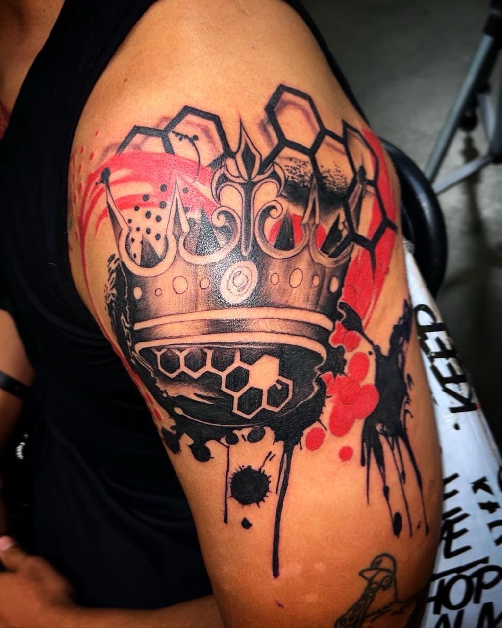 Trash Polka + Abstract crown tattoo on Upper Arm by XRayVizionz on TattMe
