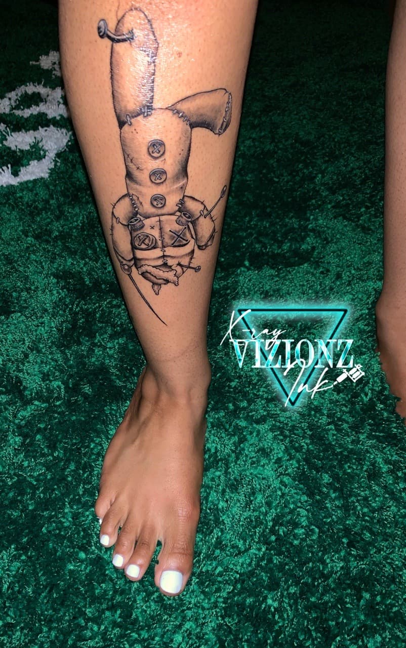 Black & Grey + Illustrative voodoo doll tattoo on Shin by XRayVizionz on TattMe