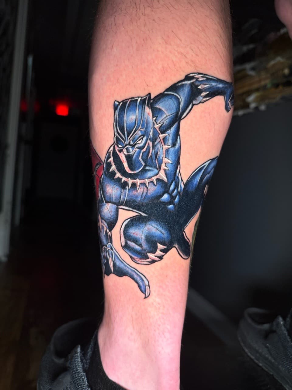 Pop Culture + Color black panther tattoo on Calf by Ria_Rabitt on TattMe