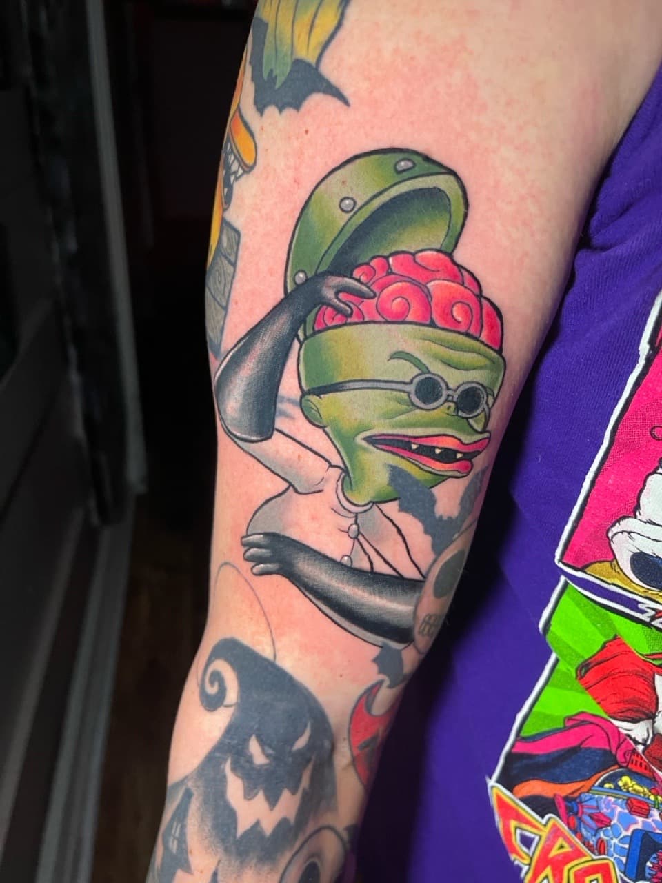 Cartoon + New School frog tattoo on Upper Arm by Ria_Rabitt on TattMe