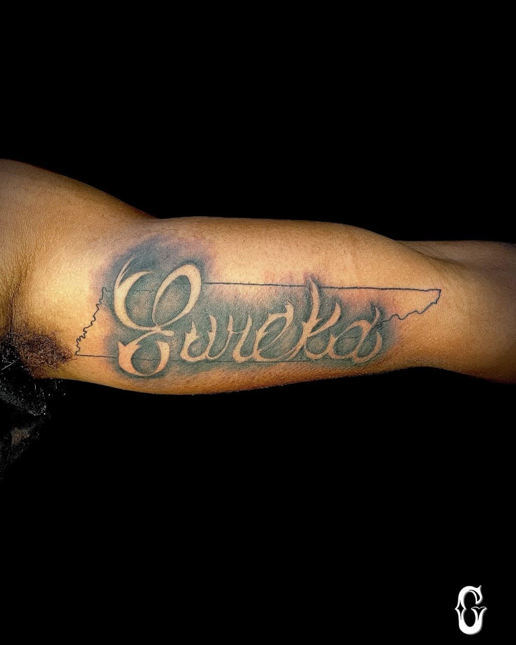 Lettering + Script eureka tattoo on Upper Arm by graypaint on TattMe