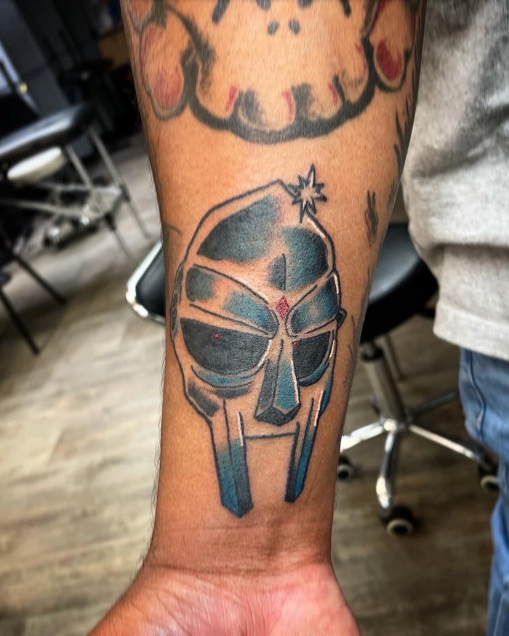 New School + Pop Culture mask tattoo on Forearm by graypaint on TattMe