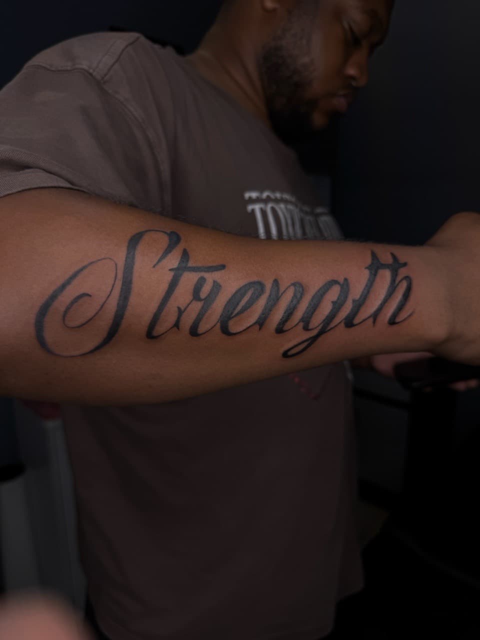 Lettering + Script strength tattoo on Forearm by Sketch_By_Lex on TattMe