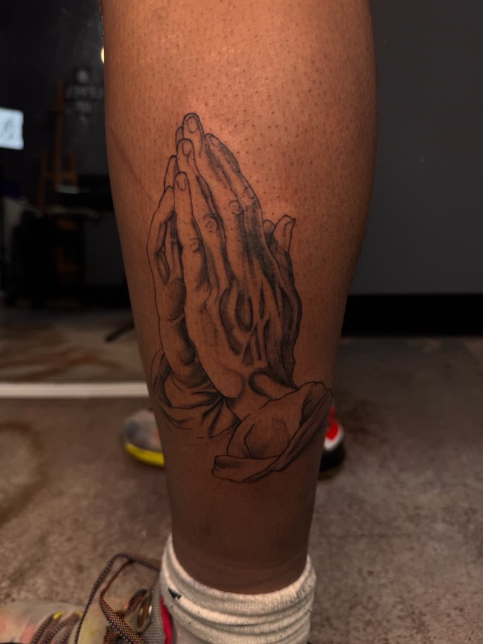 Black & Grey + Illustrative praying hands tattoo on Calf by Sketch_By_Lex on TattMe
