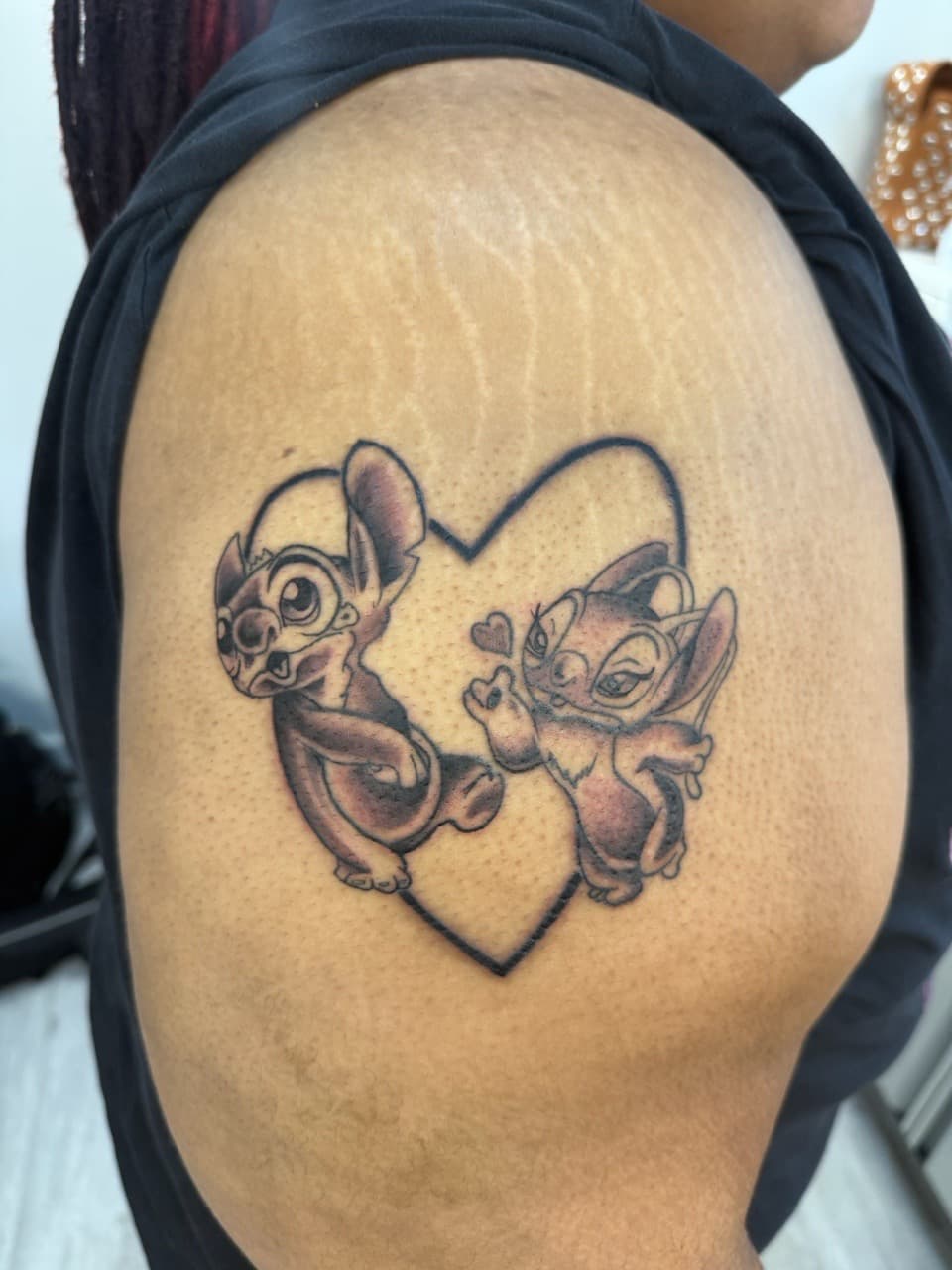Black & Grey + Cartoon stitch tattoo on Upper Arm by Almty_Inks on TattMe