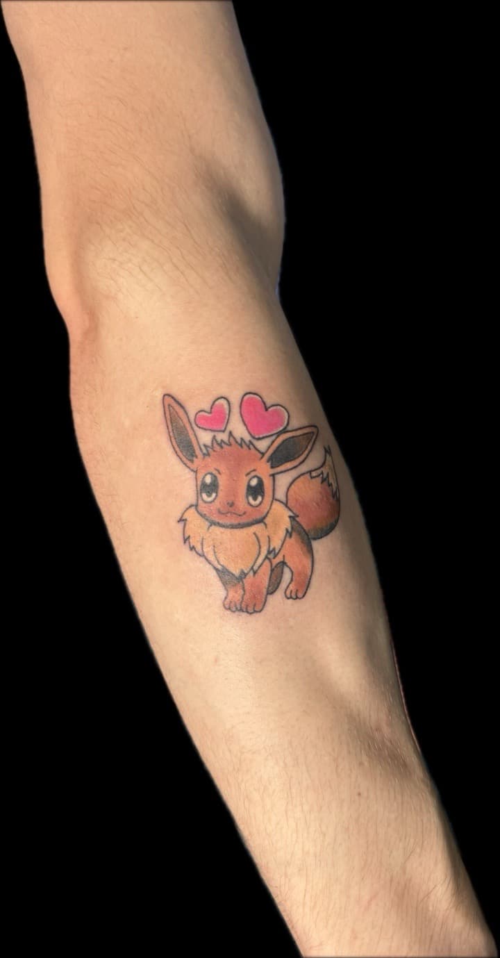 Cartoon + Pop Culture eevee tattoo on Forearm by Carmela_Bella on TattMe