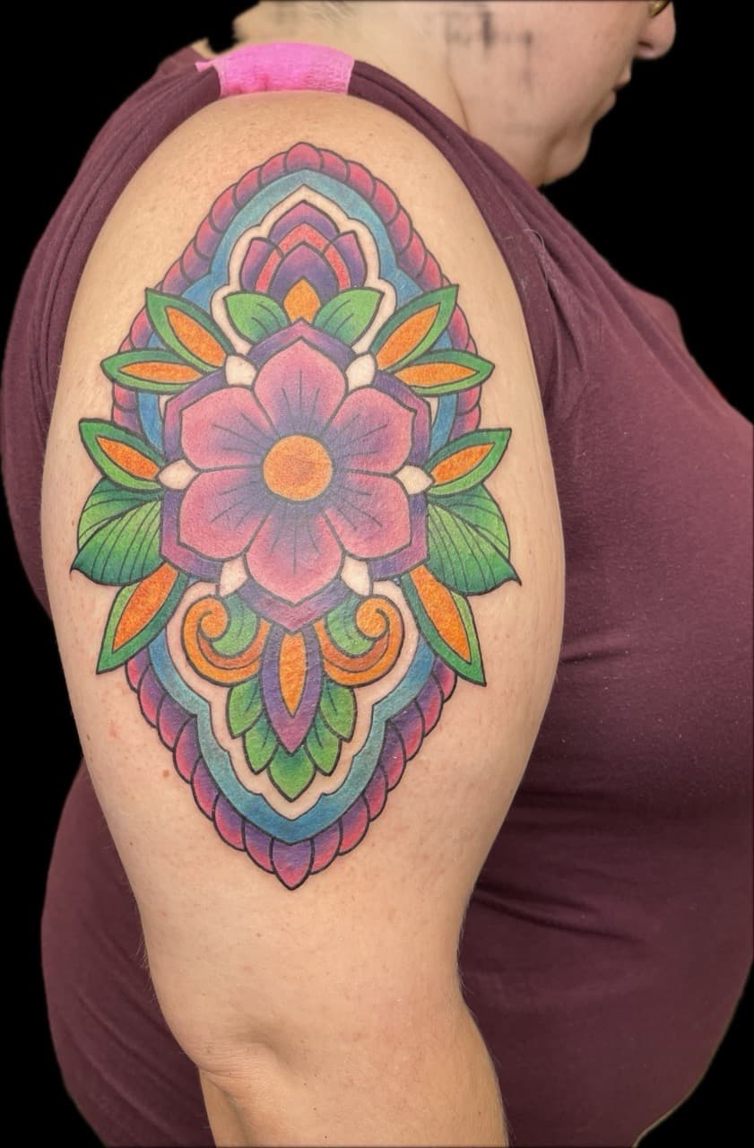Color + Geometric flower tattoo on Upper Arm by Carmela_Bella on TattMe