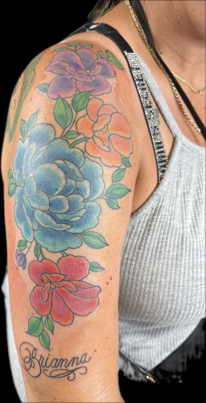 Color + Illustrative flowers tattoo on Upper Arm by Carmela_Bella on TattMe