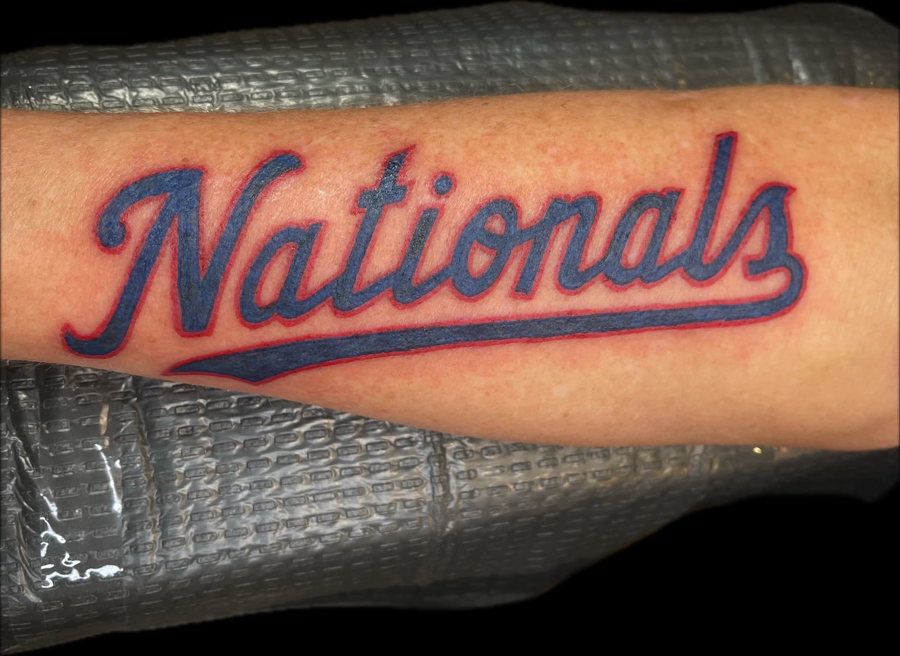 Lettering + Color nationals tattoo on Forearm by Carmela_Bella on TattMe