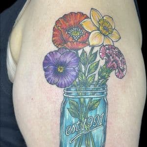 Color + Illustrative flowers tattoo on Upper Arm by Carmela_Bella on TattMe