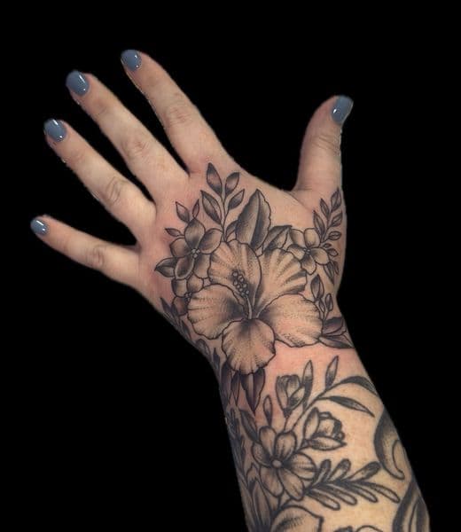 Floral + Black & Grey flowers tattoo on Hand by Carmela_Bella on TattMe