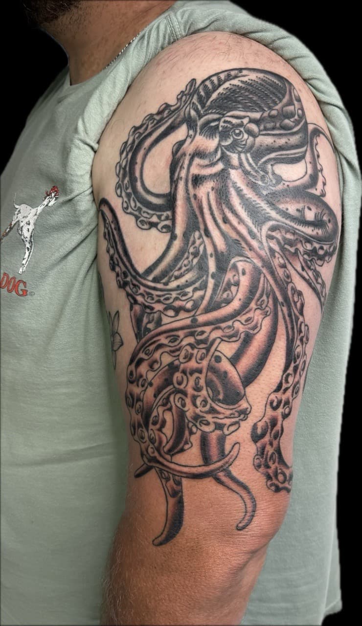 Black & Grey + Illustrative octopus tattoo on Upper Arm by Carmela_Bella on TattMe