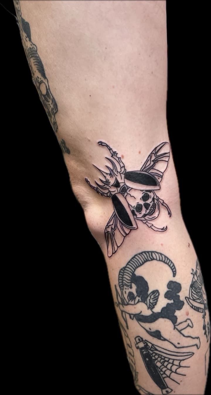 Black-work + Traditional beetle tattoo on Knee by Carmela_Bella on TattMe