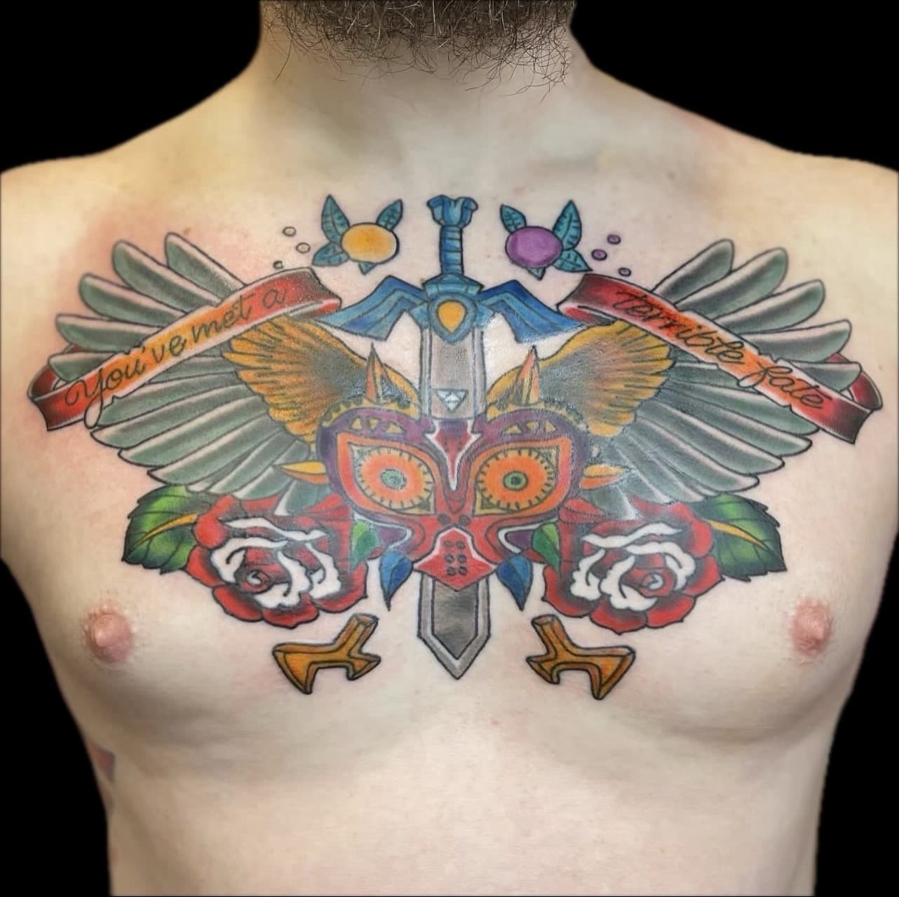 Color + Pop Culture mask tattoo on Chest by Carmela_Bella on TattMe