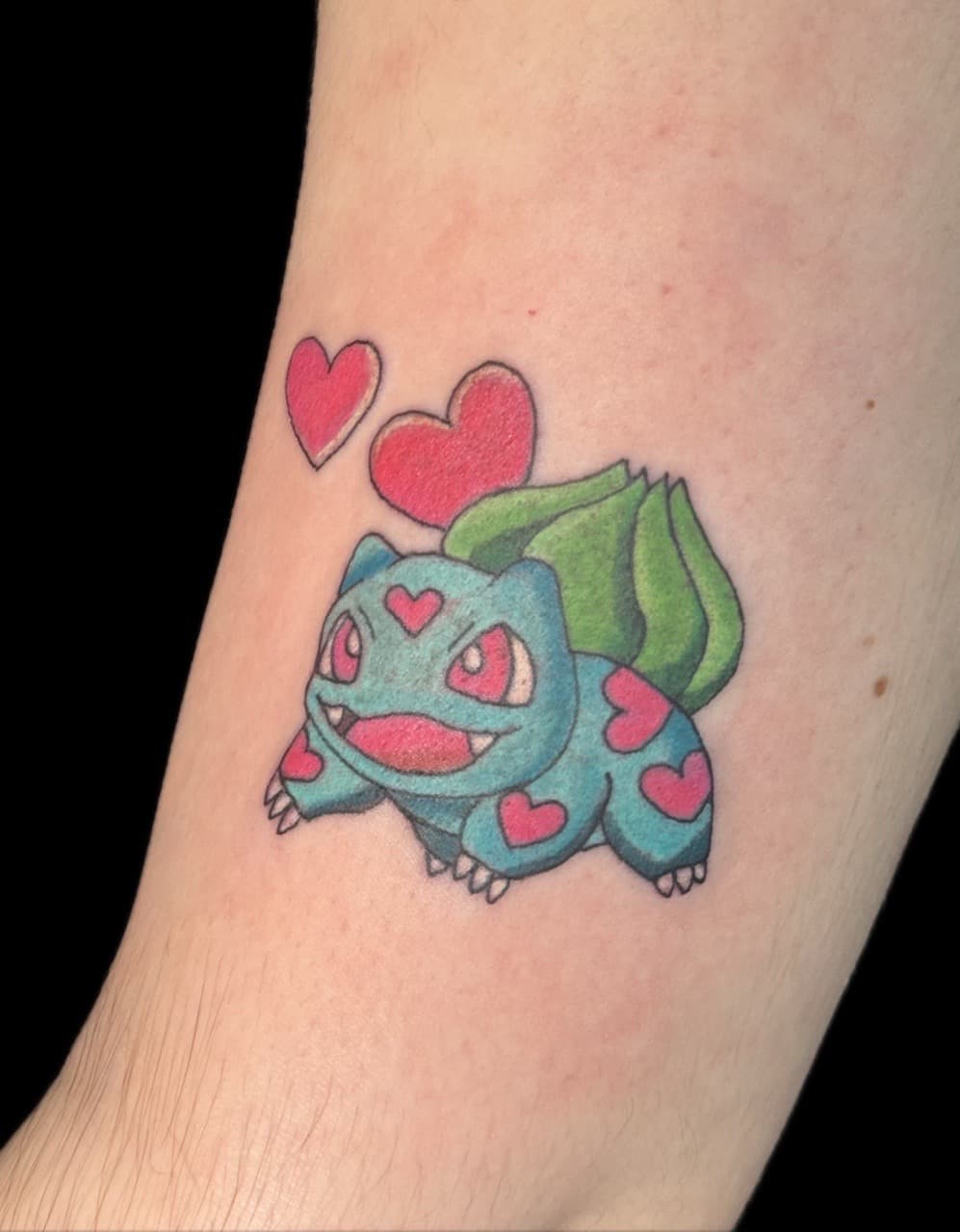 Color + Cartoon bulbasaur tattoo on Upper Arm by Carmela_Bella on TattMe