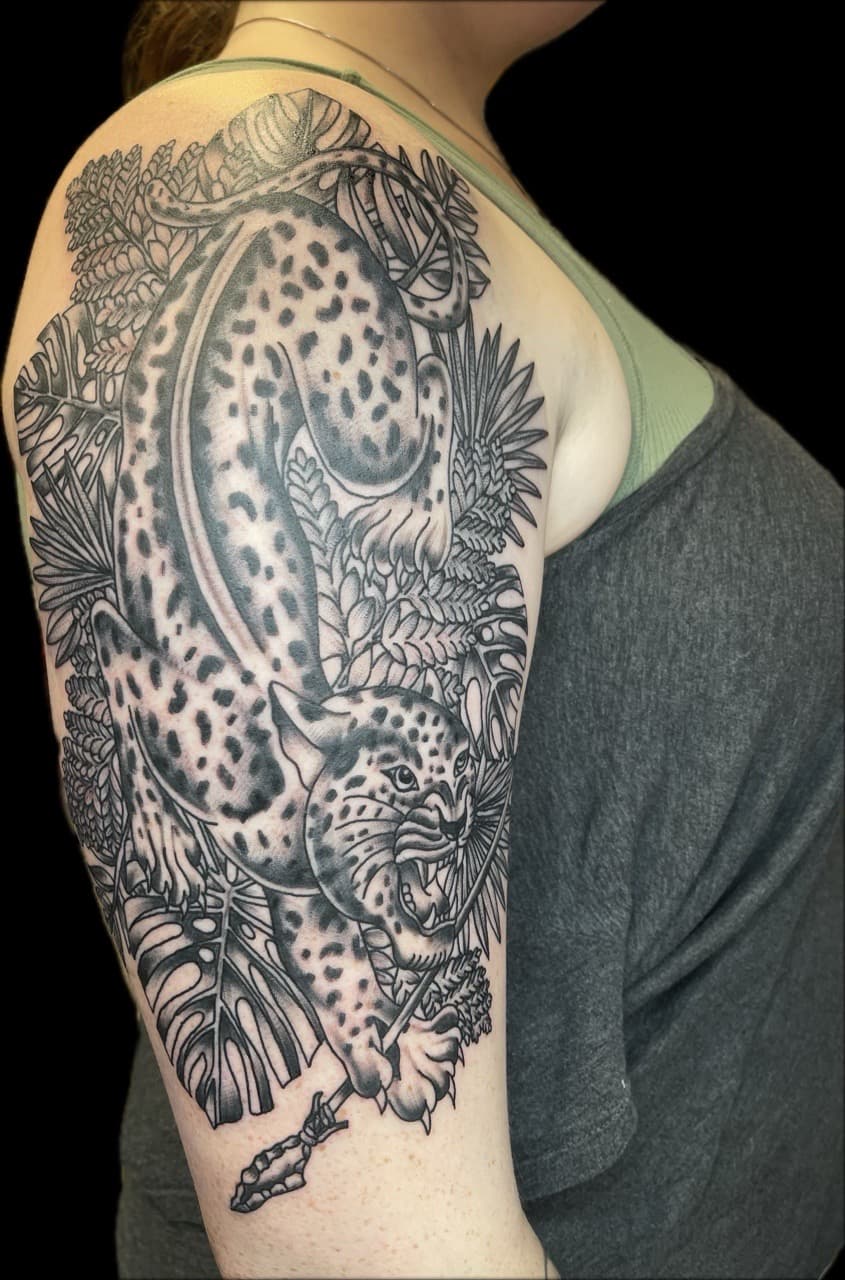 Black & Grey + Illustrative leopard tattoo on Upper Arm by Carmela_Bella on TattMe