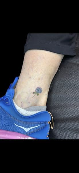 Color + Floral flower tattoo on Ankle by Carmela_Bella on TattMe